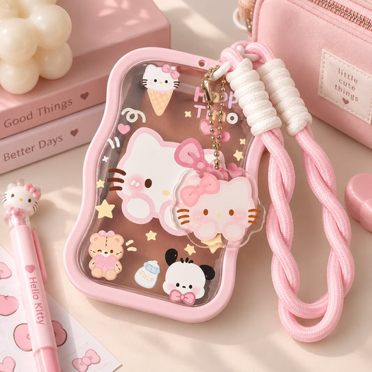 Estuche protector Brena transparente con marco rosa, diseño kawaii de gatitos y correa de mano trenzada a juego.