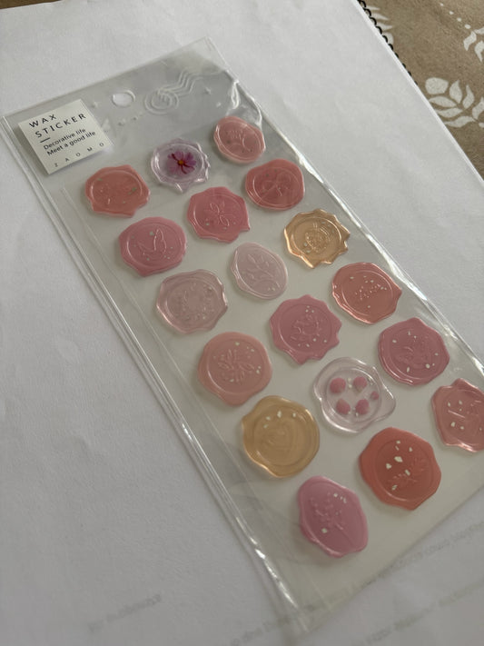 Set de stickers Brena con diseño de sello de cera en tonos rosados, melocotón y translúcidos para scrapbooking.