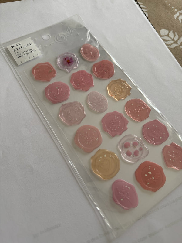 Set de stickers Brena con diseño de sello de cera en tonos rosados, melocotón y translúcidos para scrapbooking.